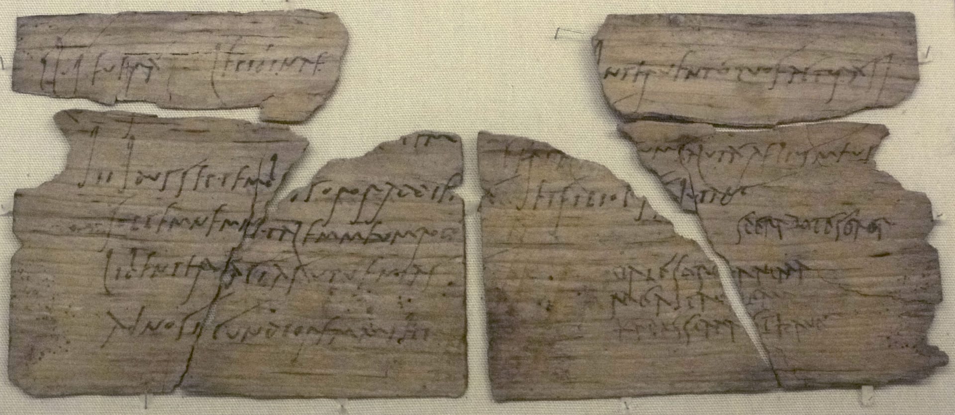 A Roman wooden writing tablet from Vindolanda, covered in cursive Latin ink in two hands, c. AD 100 (British Museum).